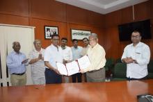 Exchange of agreement between Prof. G.U.Kulkarni, JNCASR and Mr. Prasant Sakhamuri, M.D, HHV